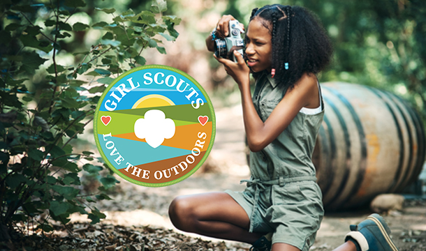  A badge that reads "Girl Scouts Love the Outdoors" 