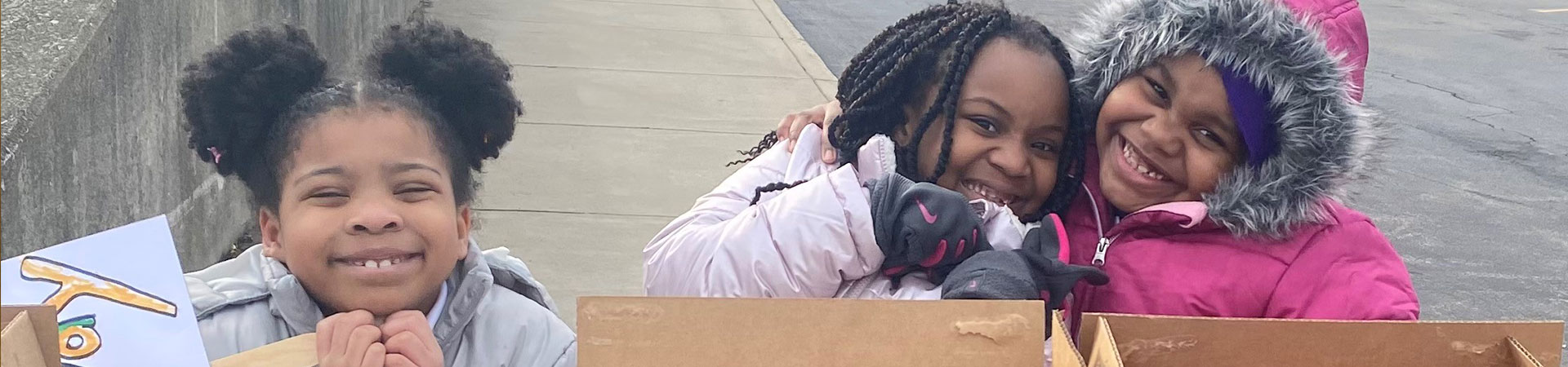  girl scout volunteer parent with young girl hiking outside at state park 