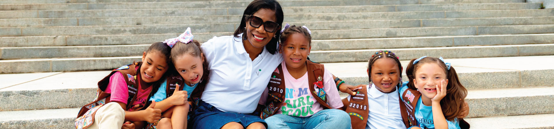  adult woman girl scout volunteer outdoors smiling 